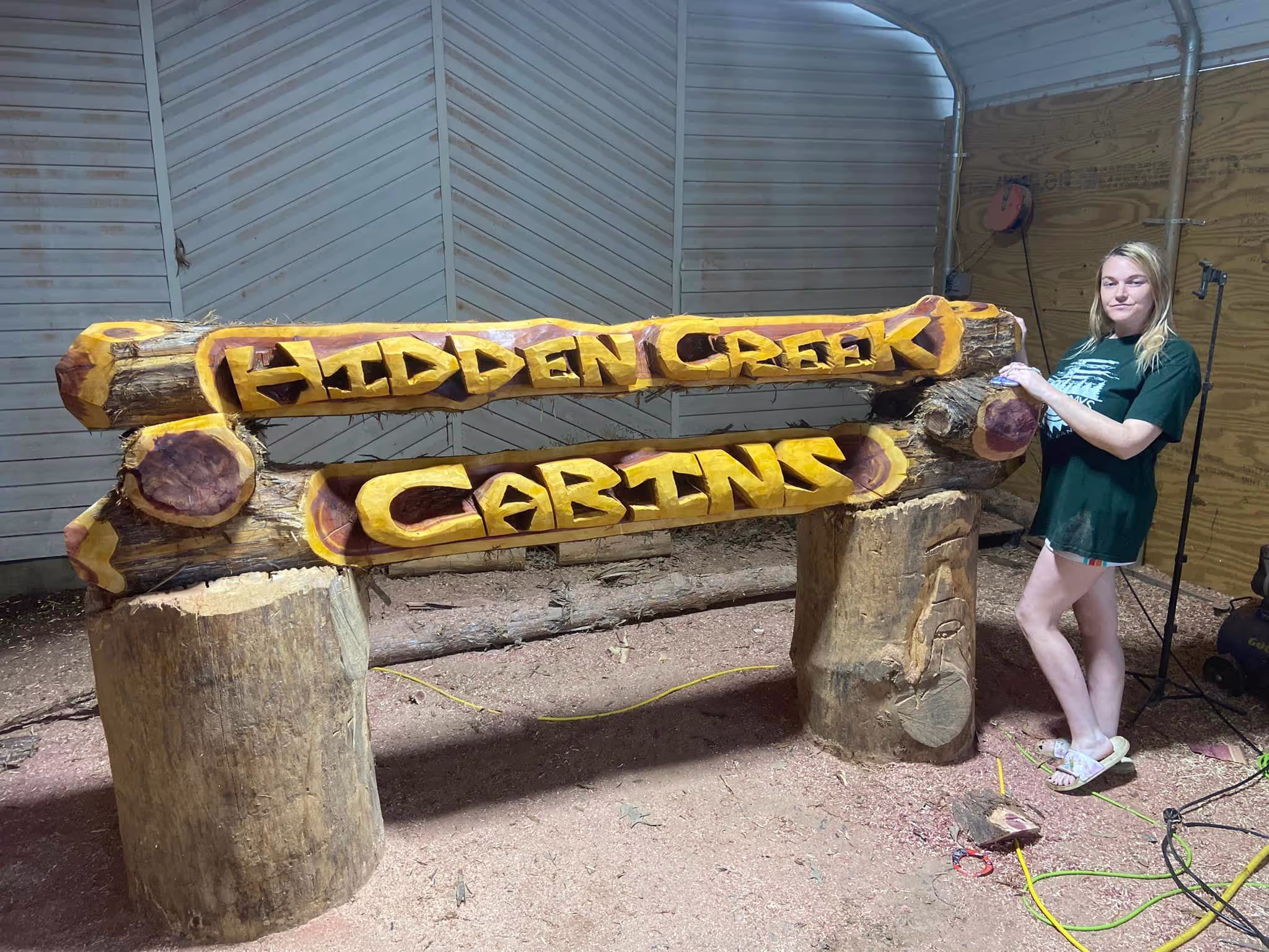 Custom carved cedar name log by Cedar Valley Carvings
