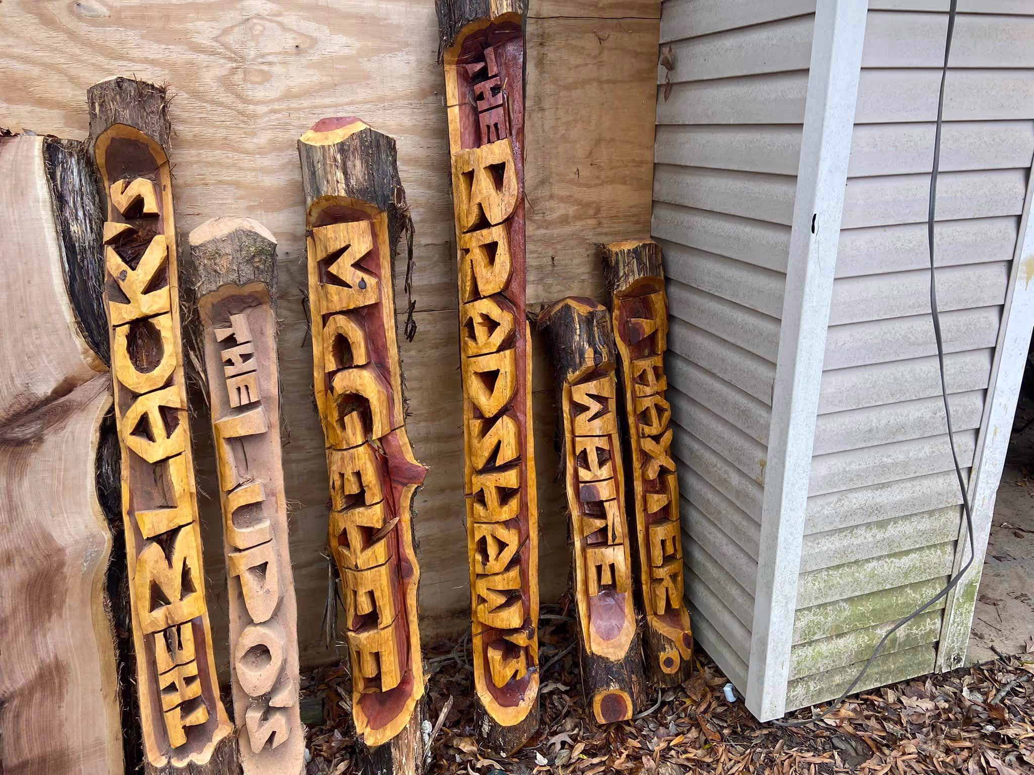 Custom carved name log